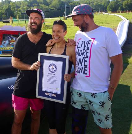 Founders of the Live More Awesome Foundation, Jimi Hunt and Dan Drupsteen pose with TODAY Show Correspondent Jenna Wolfe after receiving Guinness World Records&#xfe;&#xc4;&#xf4; certification for the World&#xfe;&#xc4;&#xf4;s Longest Inflatable Waterslide.