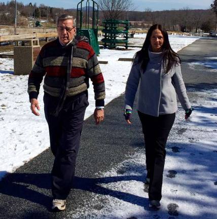 To kick off National Walking Day, Mayor Victor Marotta and Recreation Director Missi Wiedbrauk have a walking meeting at Maple Grange Park.