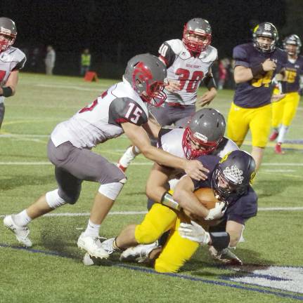 Jefferson ball carrier Michael Gould (26) is tackled by High Point defenders in the second half. Gould ran for 150 yards resulting in three touchdowns