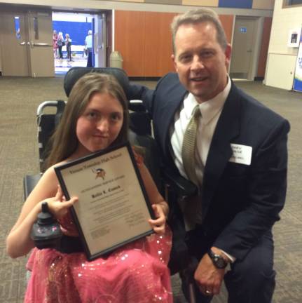 Kellie Cusack shows off her award with VTHS Principal Drew Krause.