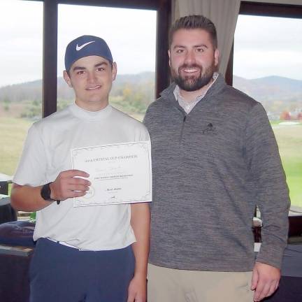 Dan Dessart,16, receives his Crystal Cup Men’s Champion prize from Crystal Springs’ Tyler Borkowski