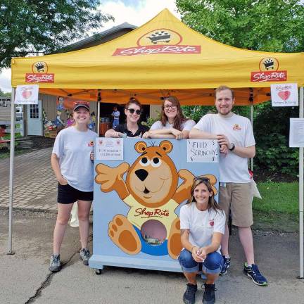 Shoprite at the fair Maggie Dougherty (Hackettstown), Kelsey Denison-Vesel (Landing), Catie Coffaro (Hamburg), Alex Douglas (Mt. Arlington), and Kayla Steele (Dingmans Ferry, PA) encourage fairgoers to “Feed Scrunchy” as a fun way to kick-off the ShopRite Partners in Caring Campaign, which provides food, goods, and funds to local food banks.
