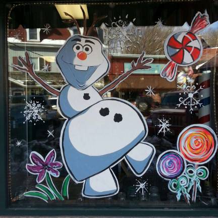 Local artist transforms ordinary store fronts into window wonderlands
