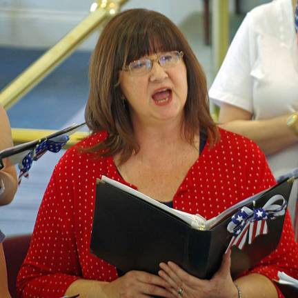 Choral Society holds concert Former Vernon Township Mayor Janet Morrison is shown singing þÄúGod Bless the USAþÄù by Lee Greenwood.