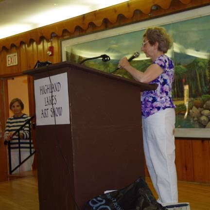 The show drew a crowd from both within the lake community and beyond. Once again, Mary Ann Mastrangelo was the volunteer chairwoman of this special recurring community presentation. She is shown here during the awards presentation.