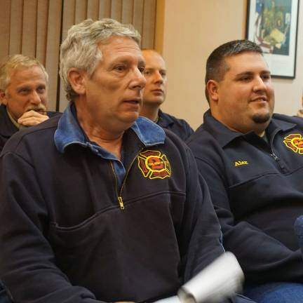 Wantage Fire Chief Larry Bono, Jr., left, is shown at the Wantage Committee meeting with department volunteers.