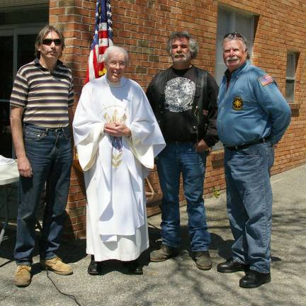 Organizers of the Biker Blessing are, from the left, John Cawley, Monsignor Robert Carroll, Dave Gallaugher, Greg Petruska, and Bob Maggio, who is not in the photo. Gallaugher and Maggio were part of the driving force that established this annual event 15 years ago.
