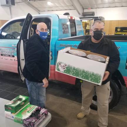 Mohawk House’s Steve Scro, left, hands off volunteer lunches to Bob Haffner, of the Sussex County Sheriff’s Office of Emergency Management. (Photo provided)