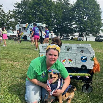 Dogs have their day Elena Philolius poses with Packers the grateful dog, who won first place in the costume contest.
