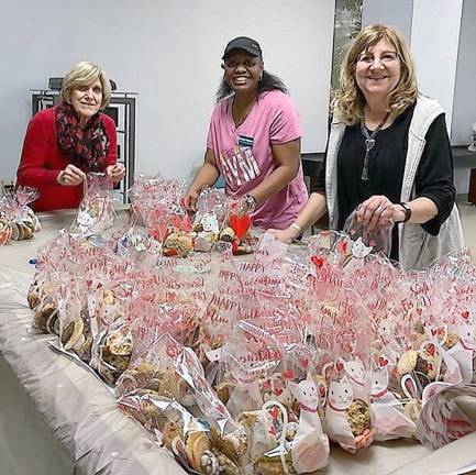 Vernon Township Woman’s Club members, from left, Elaine Kuntz, Rosetta Patterson and Karen Rothstadt display some of the 169 bags of homemade cookies their club donated to The Homestead Rehabilitation and Health Care Center in Newton.