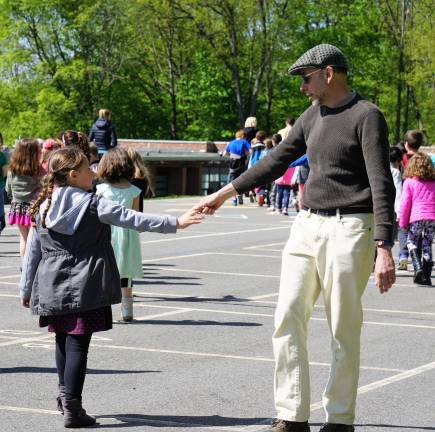 Walnut Ridge holds May Pole dance On right, Michael Moschella says goodbye to a student after the May Pole Dance.