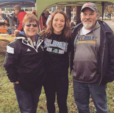 Sparta woman to run 4,000 miles to raise funds for young adults with cancer Photos provided by the Romine family Claire Romine flanked by her parents