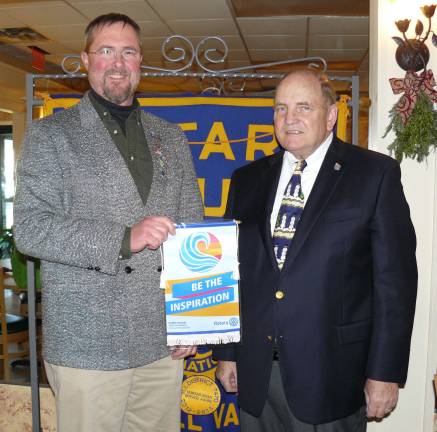 Wallkill Valley Rotary President Paul Kattermann on the left, received a banner with this year's Rotary theme 'Be The Inspiration' from District Governor John Wilson on the right, who is the Rotary District 7475 Governor.