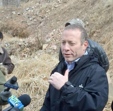 U.S. Rep. Josh Gottheimer speaks outside of the dump site on Silver Spruce Drive on Thursday.