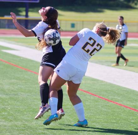 West Milford's Alexa Barca and Vernon's Paige Scovell brush against each other while going after the ball in the first period. West Milford High School (Passaic County, N.J.) defeated Vernon Township High School in girls varsity soccer on Saturday, September 23, 2017. The final score was 2-0. The game took place at Vernon Township High School in Glenwood, New Jersey.