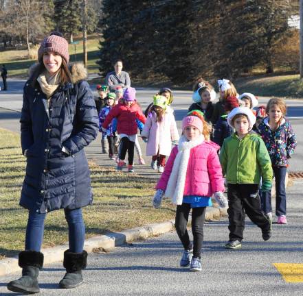 PHOTOS BY VERA OLINSKI A Kindergarten class walks over for the Glen Meadow Middle School Winter Concert.