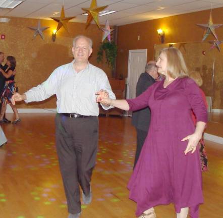 Out front, ballroom owners Russ and Katy Fischer strut their moves