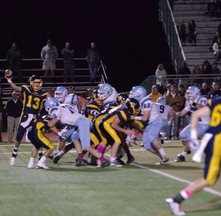 Vernon quarterback Tyler Soltes throws under heavy pressure from the Sparta defense. Soltes threw for 115 yards and two touchdowns.