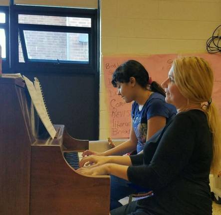 Ambuter piano students have been busy 3) Kayla C. at Glen Meadow volleyball team fundraiser (with Cherwyn Ambuter accompanying her in a duet)