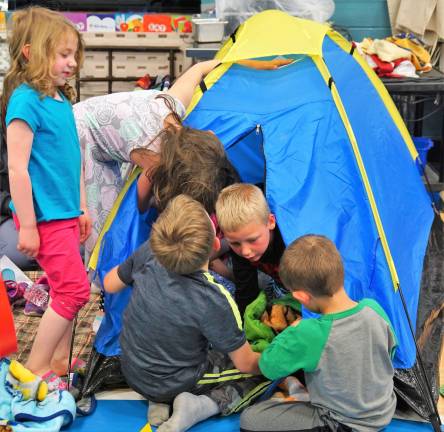 Children enjoy playing in one of the many tents.