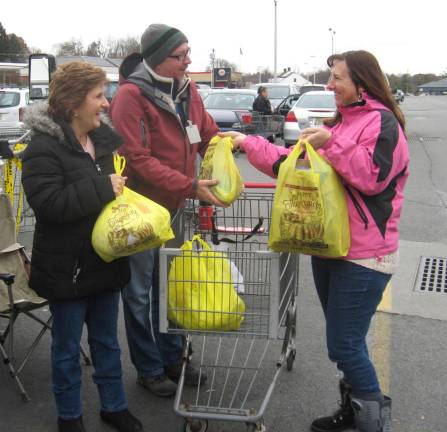 PHOTOS BY JANET REDYKEDonations were happily made at the Franklin Shop Rite for the Stuff the Bus food collection.