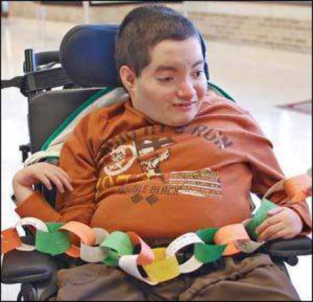 Students pen links of gratitude on paper chains Students pen links of gratitude on paper chains