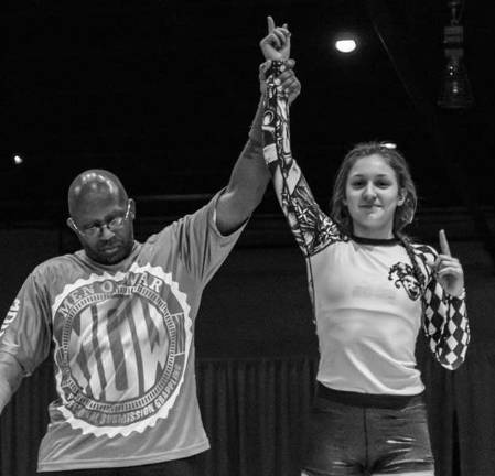 Fahey wins quick submission Brooke Fahey (right) gets her hand raised following her submission victory at Man of War 1