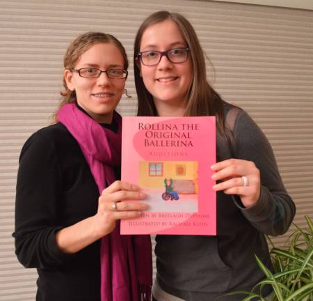 Local authors make a 'pointe' PHOTO BY DON CARSWELL Authors Rachael Klein and Breelagh DuHaime are shown with their book, "Rollina The Original Ballerina."