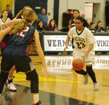 Vernon's Brietta Patterson dribbles the ball in the second period. Patterson scored ten points.