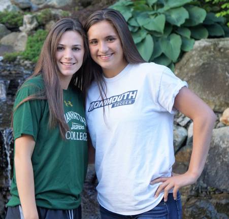 From left, Lindsey Healy and Brittany Van Lenten stand in front of a New Horizon waterfall.