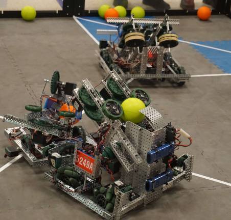 High Point hosts robotics competition Team E.L.K.'s robot, right, competes with another robot.