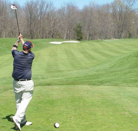 Local Vernon golfer Steve Van Dyk shows good form teeing off at the 1st Crystal Cup tournament.