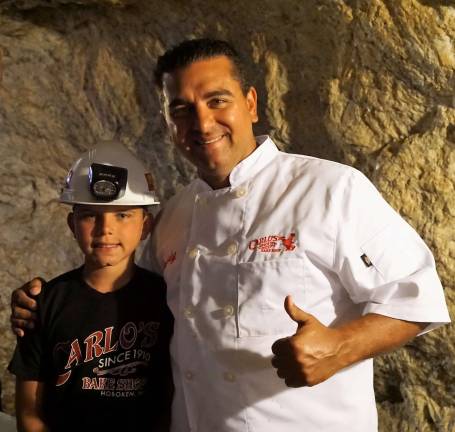 Cake Boss star Buddy Valastro poses with son in the Sterling Hill Mine.