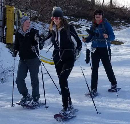 A group snowshoes during the event.