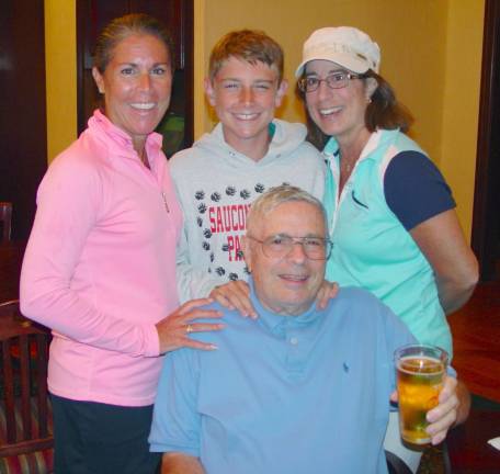 The 3 generation team of Joe Meola, age 77, Dana Meola, Jodi Little and grandson Tanner Little age 13 celebrate as special day of golf in Owen&#xfe;&#xc4;&#xf4;s Pub following golf.
