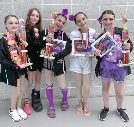 Dance Expression wins big at Wildwood competition Junior Dance Expression dancers are shown with their awards.