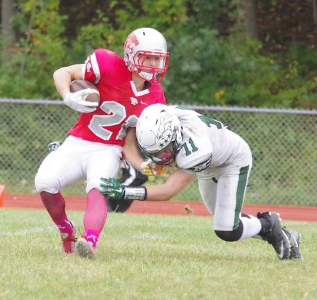High Point ball carrier Bryan Franko collides with a Montville defender during a kick return.
