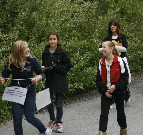 Poetry al fresco From left, Allie Freeswick, Celeste Levy and Alexa Perrotta, followed by teacher Peggy Mitchell.