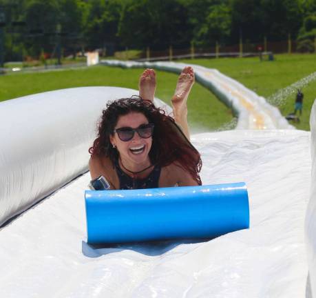 Eva Bonner, an employee for Mountain Creek/Action Park is all smiles while test-riding the World&#xfe;&#xc4;&#xf4;s Longest Waterslide on Friday, July 10.