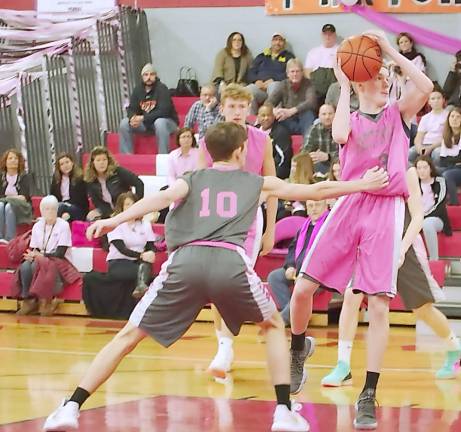 Surrounded by High Point defenders Vernon's Kyle Dunbar handles the ball during a shot attempt last season.