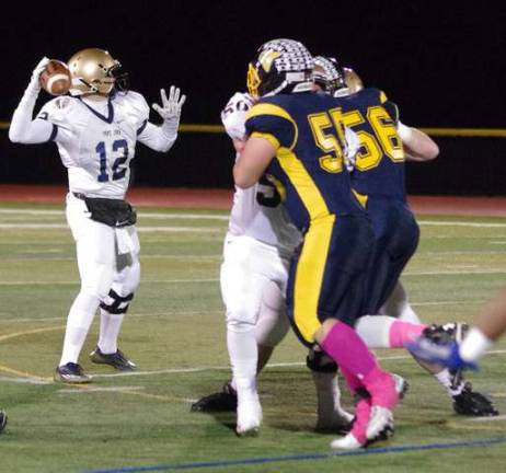 Pope John quarterback Sonny Abramson (12) threw for 221 yards and two touchdowns.