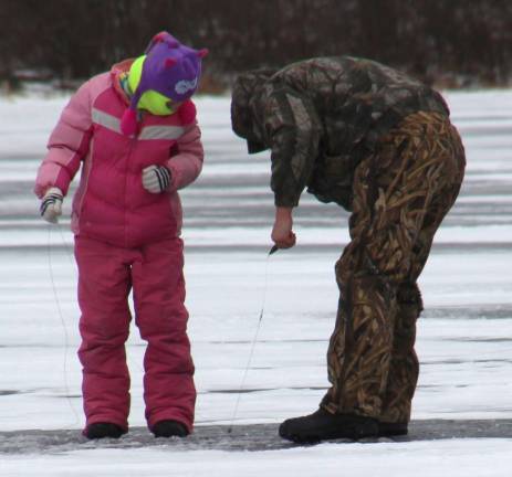 Photo by Gale Miko Locals taking advantage of the weather to do some ice fishing on the lake at High Point.