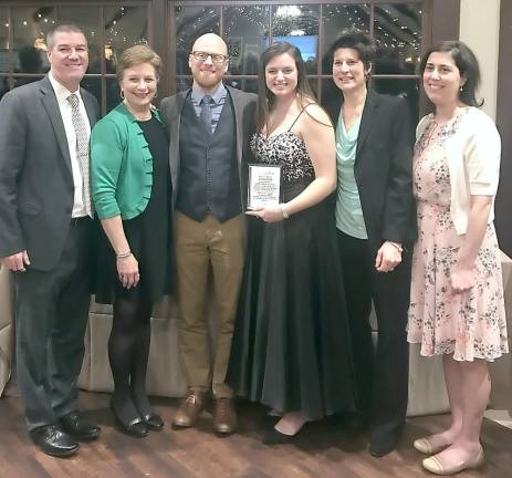 From left, AD Bill Foley, Principal Dr. Anderson, Volleyball Coach Matt Sorensen, Scholar Athlete Olivia Vizzini, Softball Coach Kerry Ludeking and Science Teacher Stella Foco.