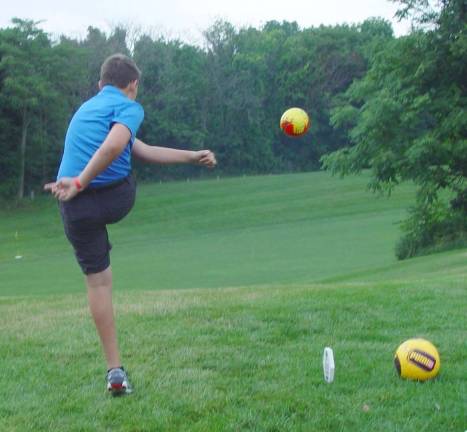 Young competitor competing in the Foot Golf Contest.