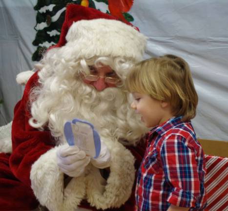 Kyle Anderson, 2, of Barry Lakes enjoyed his visit with Santa.