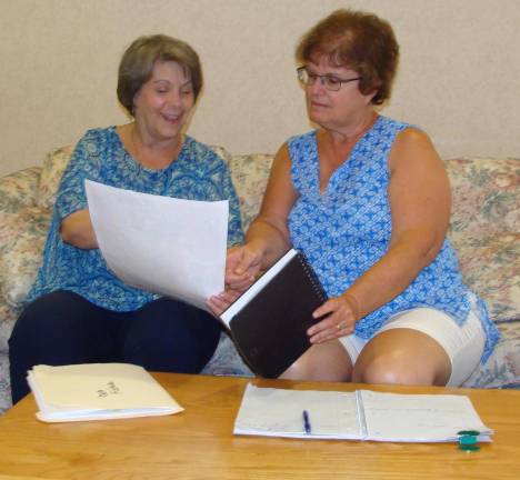 Deb Fisher, left, and Pat Faris diligently organize the 2019 Fall into Health and Wellness Fair to be held on Sept. 28