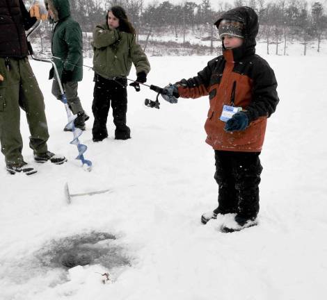 High Point Park hosts winter festival Addison Hamer from Wantage is shown ice fishing.