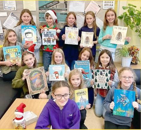 Lounsberry Hollow students read to younger children Members of the K-Kids Club at Lounsberry Hollow School read holiday stories to students at Cedar Mountain and Rolling Hills schools.