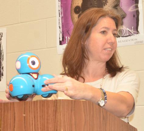 PHOTO BY TERESA SELLINGER Library Media Specialist Jennifer Paolucci introduces Trixie the Robot.
