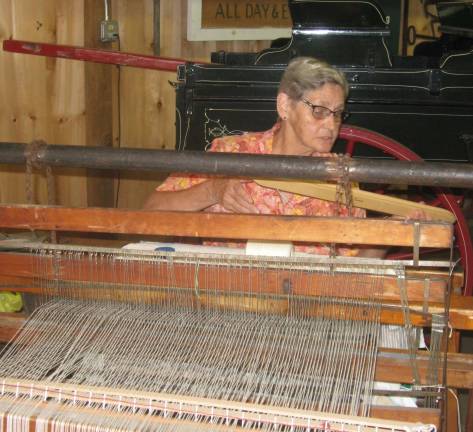 Joanne Feenstra of Sussex works on a 1800s rug loom at the New Jersey State Fair/ Sussex County Farm and Horse Show